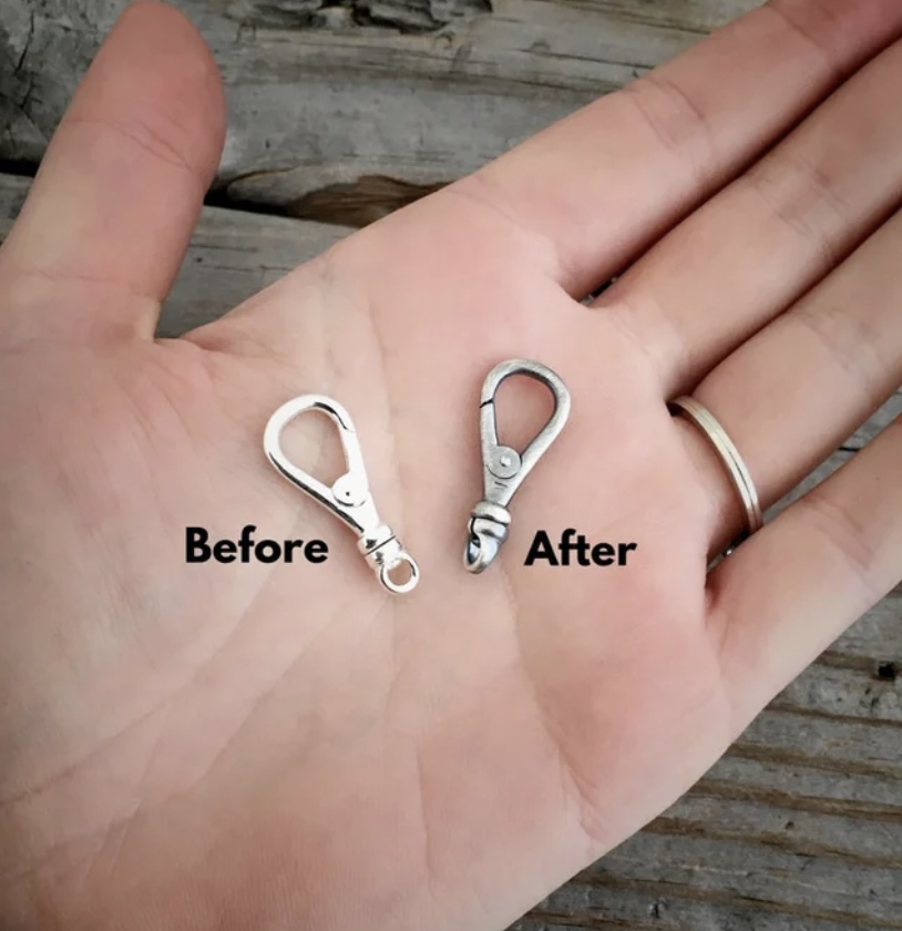 2 sterling silver clasps shown in hand one oxidized finish and the other shiny